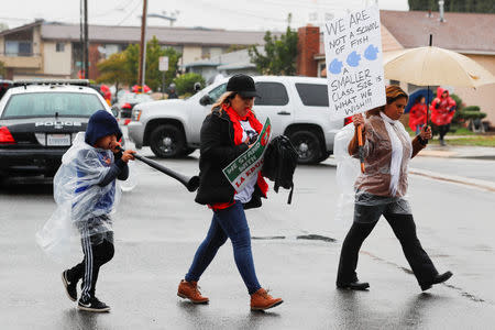 Los Angels public school teachers continue to deal with the rainy weather as their strike enters its third day in Gardena, California, U.S., January 16, 2019. REUTERS/Mike Blake