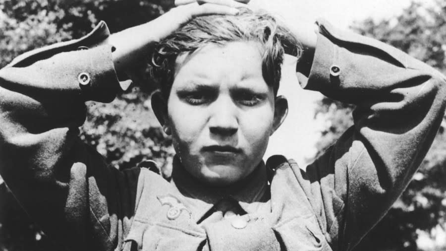 A 16-year-old German soldier clasps his hands over his head to be taken prisoner following the Allied invasion of Normandy. (AP file)