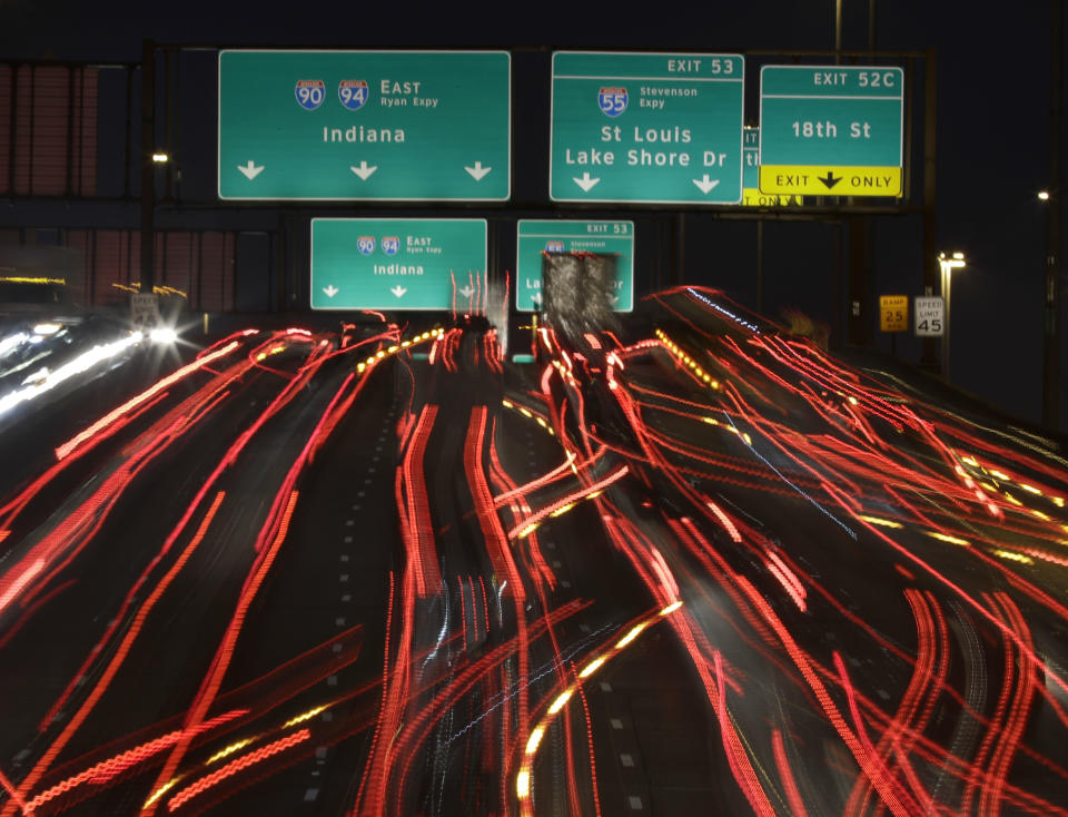 FILE - Motorist traveling southbound on Interstates 90 and 94 for Indiana approach the intersection with Interstate 55 for St. Louis, Dec. 21, 2017, in Chicago. The $1 trillion infrastructure bill that President Joe Biden signs into law on Monday, Nov. 15, 2021, represents a historic achievement at a time of deeply fractured politics. But the compromises needed to bridge the political divide suggest that the spending might not be as transformative as Biden has promised for the U.S. economy. (AP Photo/Charles Rex Arbogast, File)