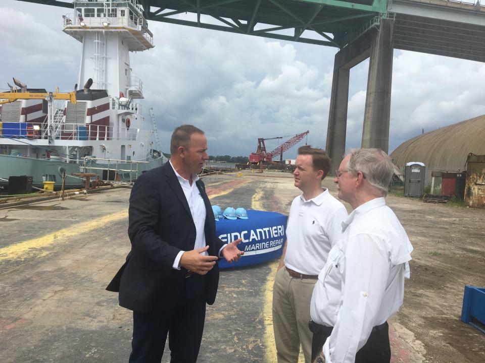 Ryan Smith, CEO of Fincantieri Marine Repair, talks with state Rep. Clay Yarborough and U.S. Rep. John Rutherford on Friday about the company's plans for expanding capacity for ship repairs at its Jacksonville site.
