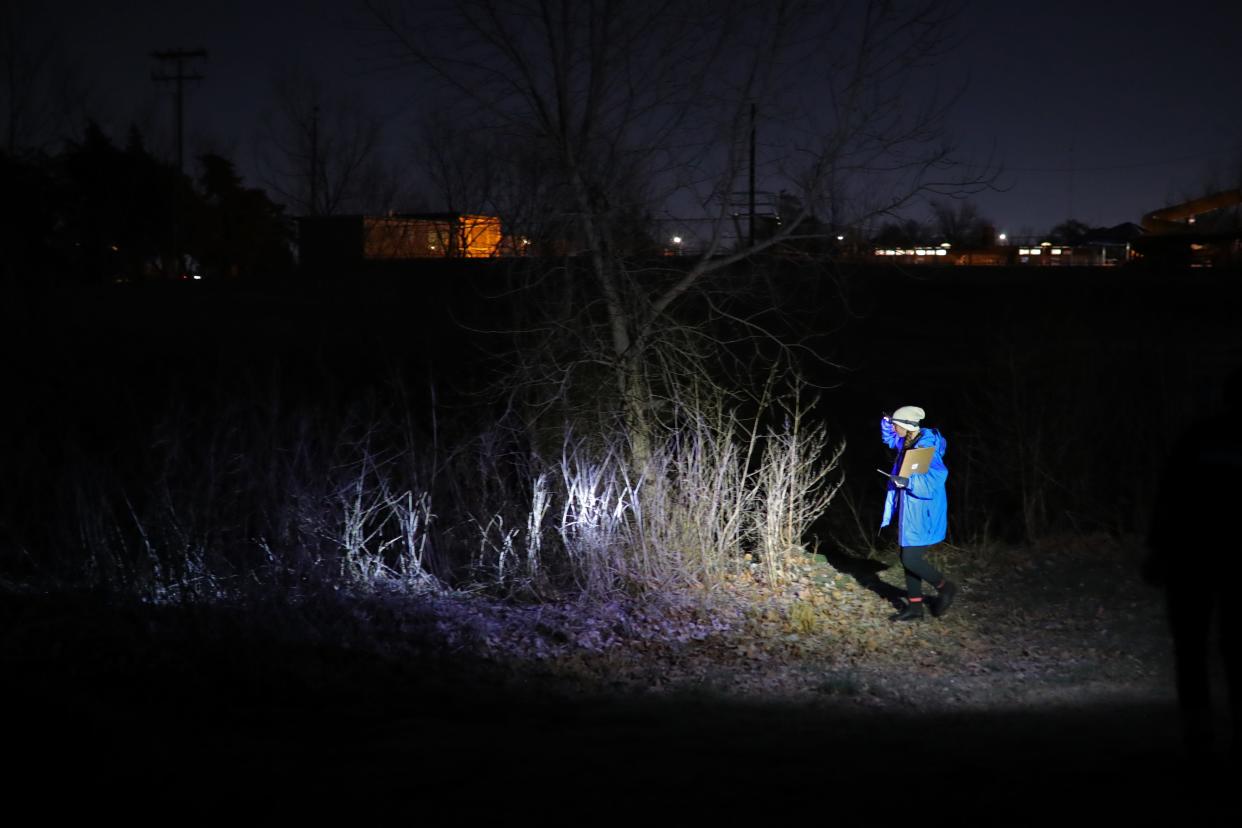 Hailey Drylie-Junker, who works with the Homeless Alliance's Curbside Chronicle street newspaper, walks along a creek Jan. 26 in northwest Oklahoma City during the Point in Time count of the homeless population.