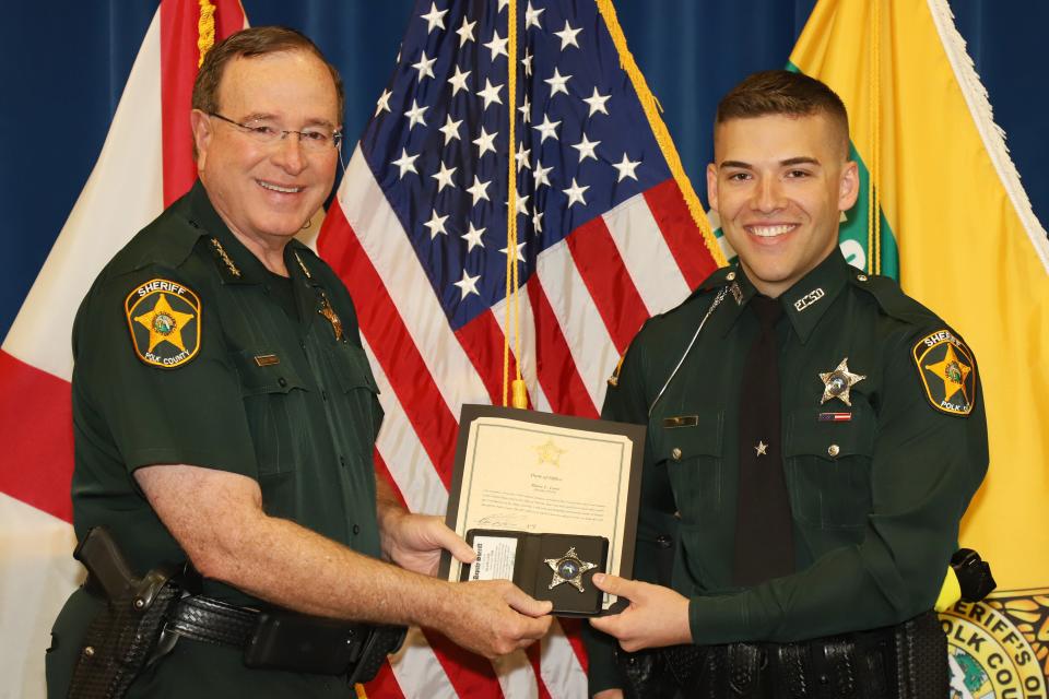 Deputy Blane Lane, right, with Sheriff Grady Judd in a sheriff's department photo. Lane, 21, was killed early Tuesday while serving a warrant.