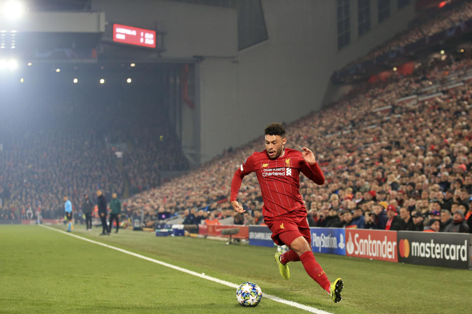 Liverpool's Alex Oxlade-Chamberlain runs with the ball during the Champions League group E soccer match between Liverpool and Genk at Anfield Stadium, Liverpool, England, Tuesday, Nov. 5, 2019. (AP Photo/Jon Super)