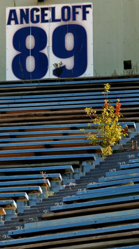 A sign with the number of University of Akron football player Chris Angeloff hangs in the closed end of the Rubber Bowl in Akron in the Oct. 11, 2103 file photo. (Ed Suba Jr./Akron Beacon Journal)