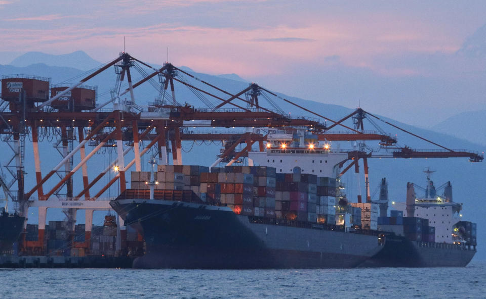 Cargo ship M/V Bavaria waits for loading of containers as it is docked at Subic port in Zambales province, northwestern Philippines on Thursday, May 30, 2019. A Philippine official says a cargo ship has arrived in a northern port to pick up and return 69 containers of Canadian garbage which the government in Manila says was shipped illegally to the Philippines years ago. (AP Photo/Aaron Favila)