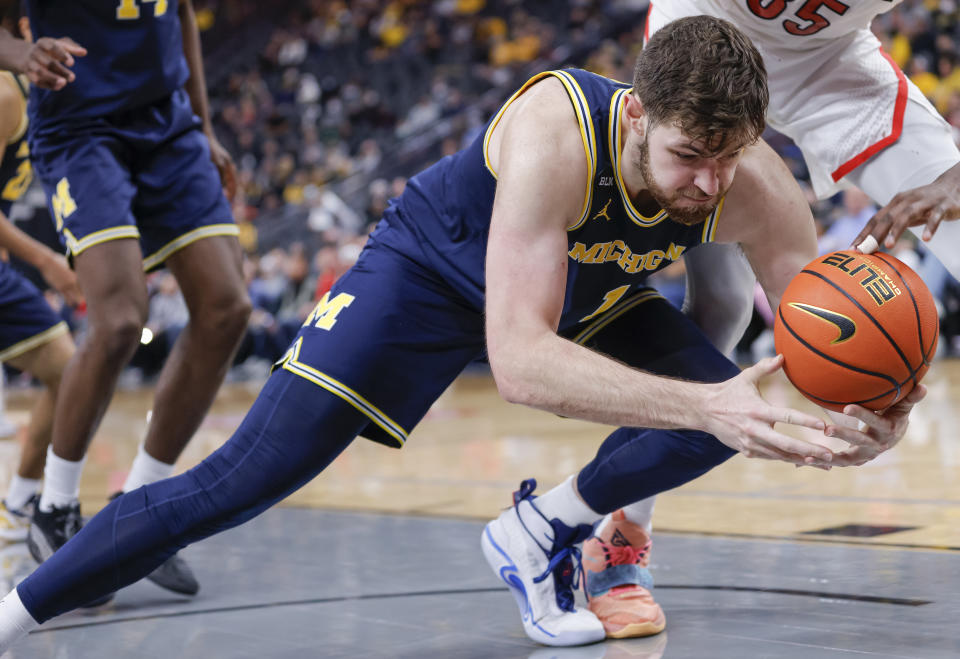 Hunter Dickinson of the Michigan Wolverines will try to get his team a big road win at North Carolina. (Photo by Michael Hickey/Getty Images)