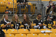 Pittsburgh Steelers fans sit without masks during the first half of an NFL football game between the Pittsburgh Steelers and the Philadelphia Eagles in Pittsburgh, Sunday, Oct. 11, 2020. It is the first game that some 5000 fans have been allowed to attend. (AP Photo/Don Wright)