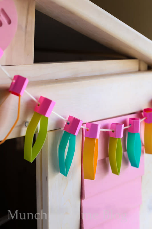 <p>Munchkin Time</p><p>This strand of lights by <em><a href="https://www.munchkintime.com/diy-kids-room-decor-paper-lights/?ref=pcrorganicgglunkwn&prid=pcseogglunkwn" rel="nofollow noopener" target="_blank" data-ylk="slk:Munchkin Time;elm:context_link;itc:0;sec:content-canvas" class="link rapid-noclick-resp">Munchkin Time</a></em> doesn’t need to be plugged in. Kids can use their favorite colored construction paper to create holiday lights that will stand out in your house and can be hung anywhere.</p>