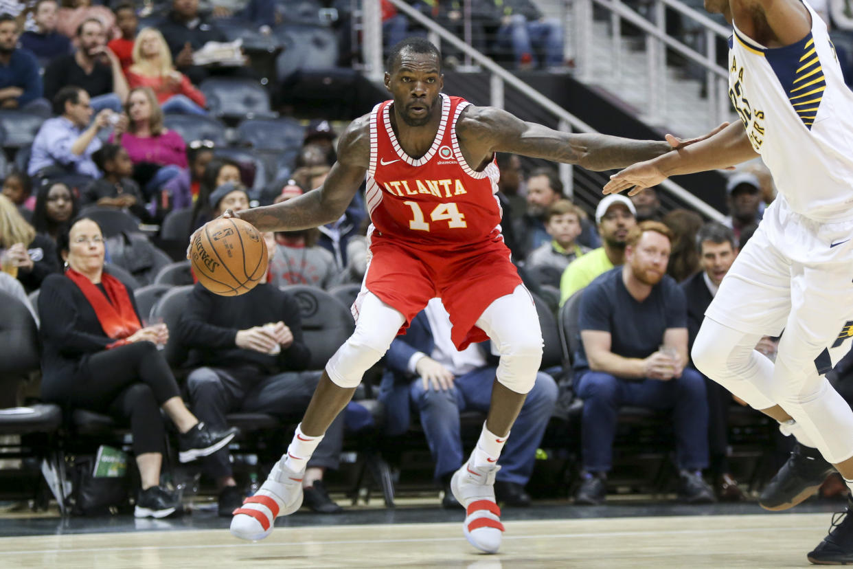 Dewayne Dedmon averaged 10 points, 7.9 rebounds and 1.5 assists in 62 games and 46 starts for the Hawks last season. (AP)