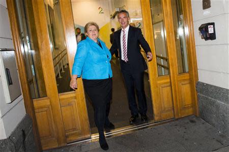 Norway's Prime Minister Jens Stoltenberg (R) and main opposition leader Erna Solberg leave a building after an appeareance on a television show in Oslo, September 8, 2013. REUTERS/Fredrik Varfjell/NTB Scanpix