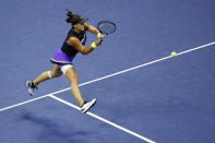 Bianca Andreescu, of Canada, returns a shot to Taylor Townsend, of the United States, during the fourth round of the U.S. Open tennis tournament, Monday, Sept. 2, 2019, in New York. (AP Photo/Jason DeCrow)