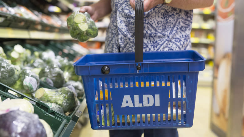 Aldi shopper picking produce