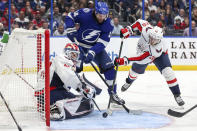 Washington Capitals goaltender Vitek Vanecek, of Czech Republic, makes a save against Tampa Bay Lightning's Pat Maroon as Lars Eller, of Denmark, defends during the second period of an NHL hockey game Monday, Nov. 1, 2021, in Tampa, Fla. (AP Photo/Mike Carlson)