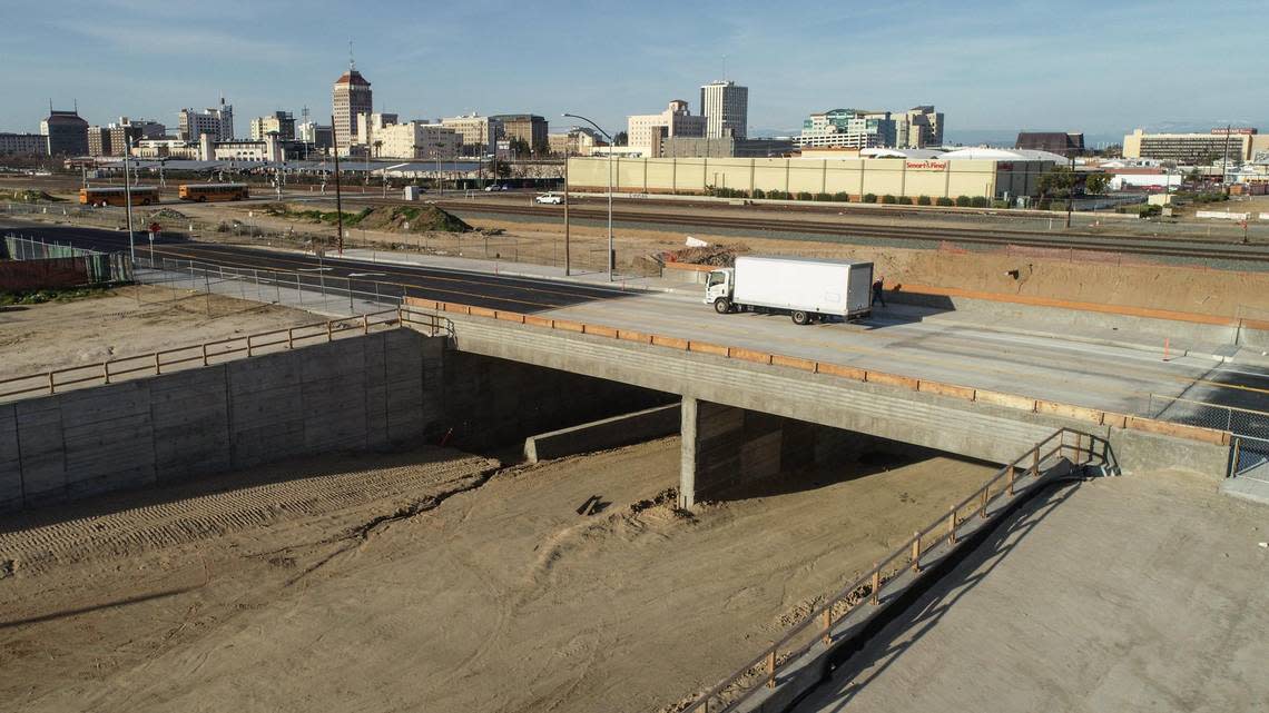 A truck passes over the Tulare Street underpass at G Street in Fresno’s Chinatown on Friday, Feb. 17, 2023. Construction continues in the area where California’s High-Speed Rail project will pass through.