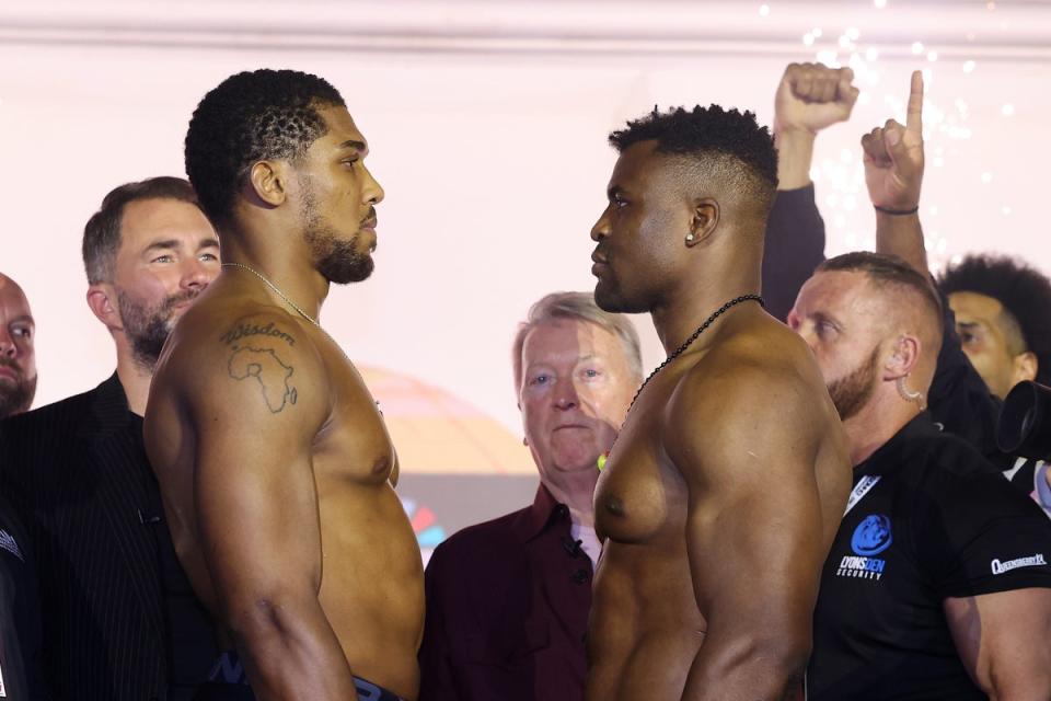 Anthony Joshua (left) and Francis Ngannou after weighing in for their bout (Getty Images)