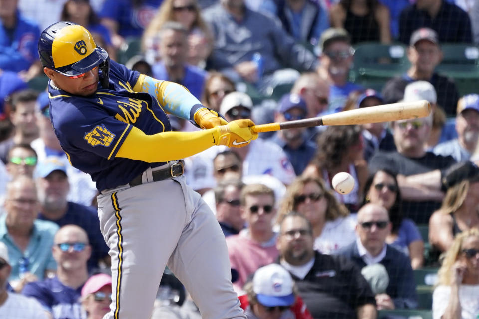 Milwaukee Brewers' William Contreras hits an RBI single off Chicago Cubs starting pitcher Kyle Hendricks during the third inning of a baseball game Wednesday, Aug. 30, 2023, in Chicago. Christian Yelich scored on the play. (AP Photo/Charles Rex Arbogast)