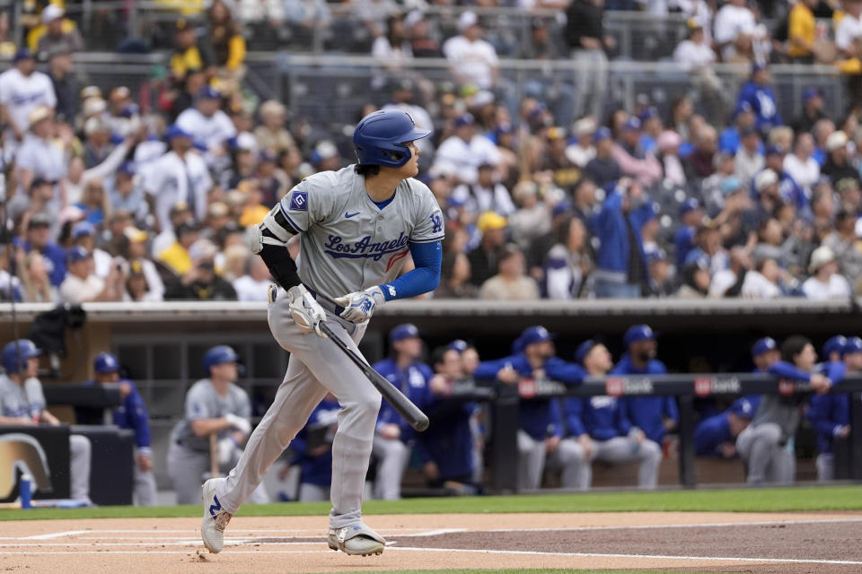 Los Angeles Dodgers' Shohei Ohtani watches his flyout during the first inning of a baseball game against the San Diego Padres, Saturday, May 11, 2024, in San Diego. (AP Photo/Gregory Bull)