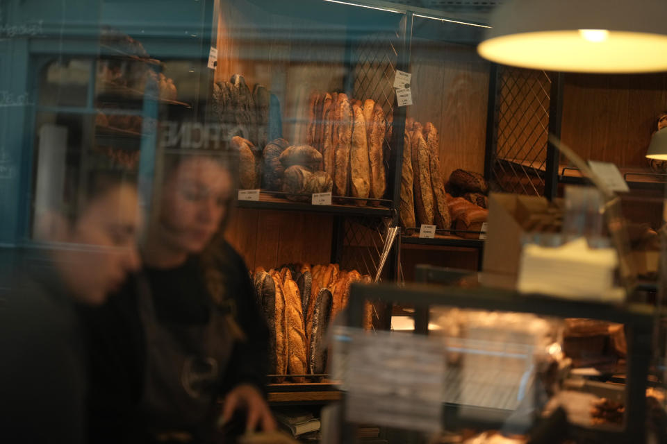 Customers are seen the Utopie bakery Friday, April 26, 2024 in Paris. Baker Xavier Netry was chosen this week as the 31st winner of Paris' annual "Grand Prix de la baguette" prize. The Utopie bakery in Paris' 11th district that Netry works for wins 4,000 euros ($4,290) and becomes one of the suppliers of the presidential Elysee Palace for a year. (AP Photo/Thibault Camus)