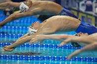 Ryan Murphy participates in the men's 100 backstroke during wave 2 of the U.S. Olympic Swim Trials on Tuesday, June 15, 2021, in Omaha, Neb. (AP Photo/Charlie Neibergall)