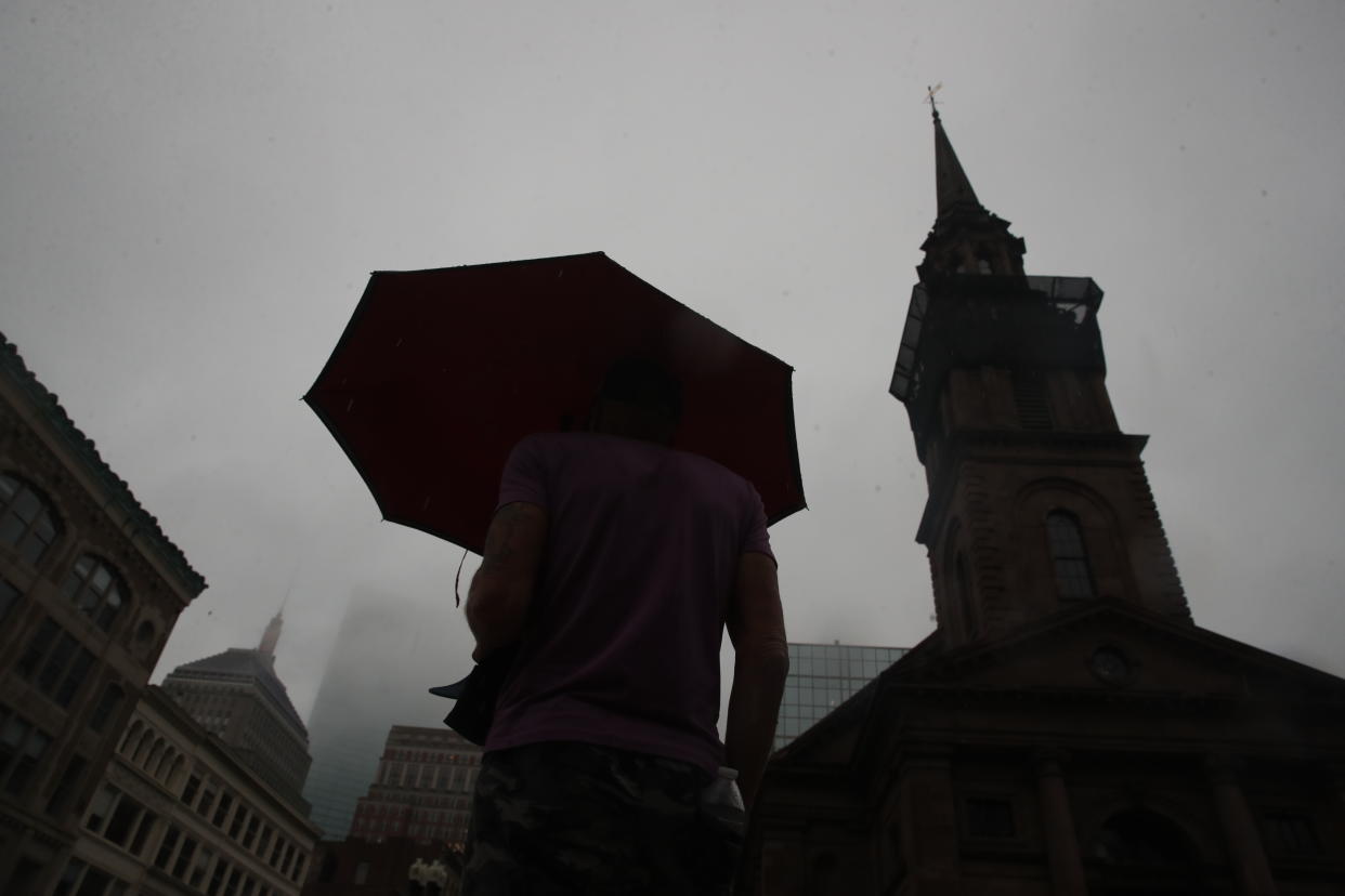 A man walks on Boylston Street in Boston on Thursday. (Craig F. Walker/The Boston Globe via Getty Images)
