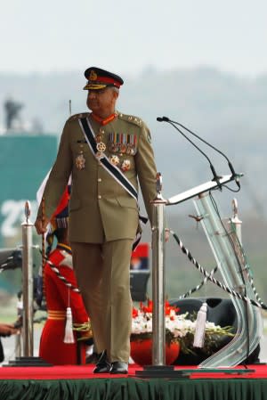 Pakistan's Army Chief of Staff General Qamar Javed Bajwa, walks as he arrives to attend the Pakistan Day military parade in Islamabad,