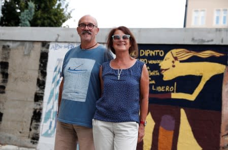 Pfitzenreiter and Pfitzenreiter, former East German refugees, pose for a photo in Sopron