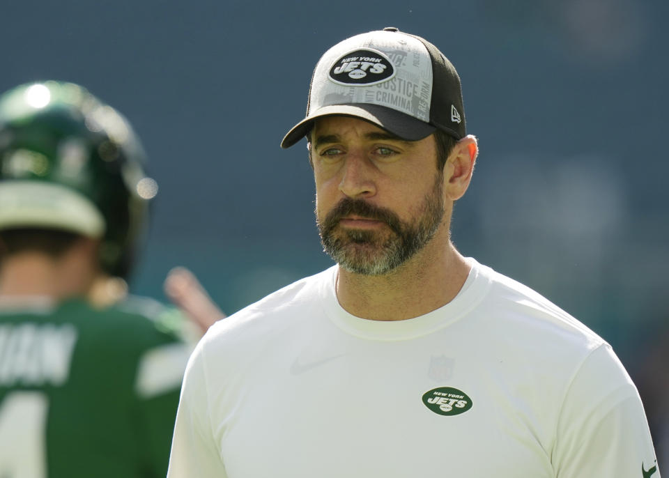 New York Jets quarterback Aaron Rodgers walks the field before an NFL football game against the Miami Dolphins, Sunday, Dec. 17, 2023, in Miami Gardens, Fla. (AP Photo/Lynne Sladky)