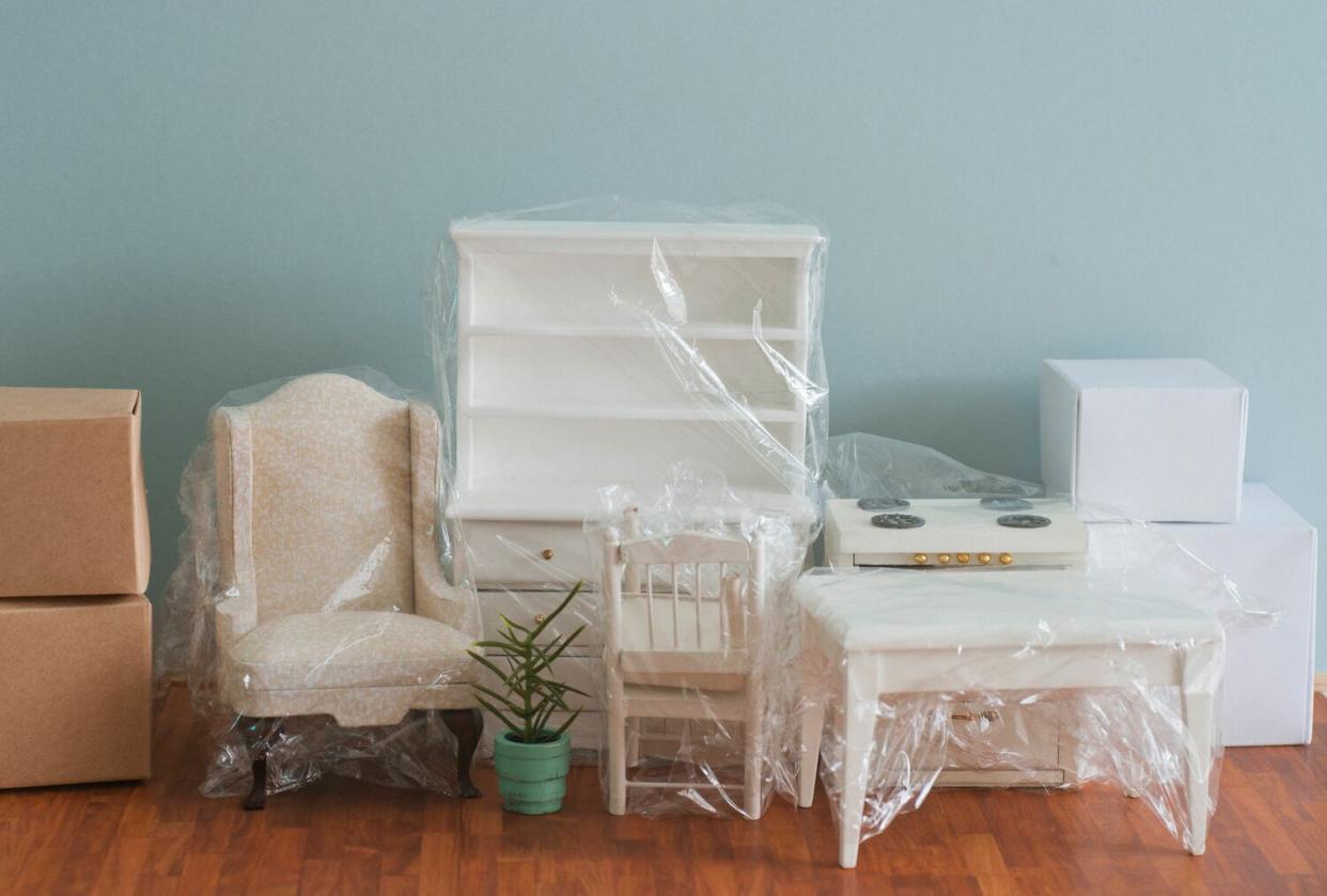 furniture wrapped in plastic