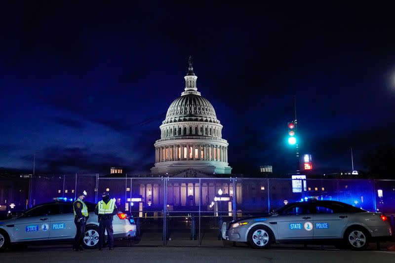 The U.S. Capitol is seen behind heavy-duty security fencing the day after supporters of U.S. President Donald Trump stormed the Capitol in Washington