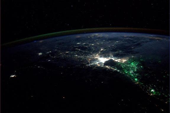 A NASA astronaut captured this view of Bangkok, Thailand at night. The green lights are used by fishing boats to attract plankton and fish.