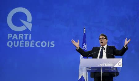 Parti Quebecois leader Pierre Karl Peladeau gestures as he speaks after being elected during a ceremony at the convention center in Quebec City, May 15, 2015. Peladeau stepped down on May 2, 2016, less than a year after being elected, saying he needed to choose his family over his work. REUTERS/Mathieu Belanger/File Photo
