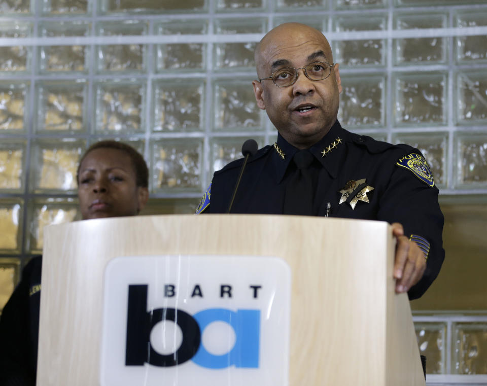 Bay Area Rapid Transit police chief Kenton Rainey, right, talks about the shooting of a BART officer who was killed by a fellow officer during a news conference Wednesday, Jan. 22, 2014, in Oakland, Calif. Authorities say a San Francisco Bay Area public transit officer who was shot and killed Tuesday by a fellow officer while searching an apartment was looking for a laptop and other stolen items. Rainey declined to disclose any further details of how the shooting of Sgt. Tom Smith occurred. A robbery suspect was in custody. (AP Photo/Eric Risberg)