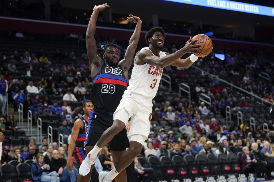 Cleveland Cavaliers guard Caris LeVert (3) drives on Detroit Pistons center Isaiah Stewart (28) in the first half of an NBA basketball game in Detroit, Friday, Nov. 4, 2022. (AP Photo/Paul Sancya)