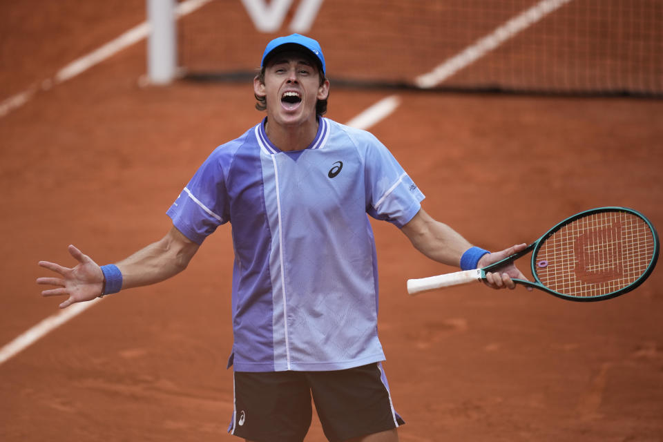 Australia's Alex De Minaur celebrates winning his fourth round match of the French Open tennis tournament against Russia's Daniil Medvedev at the Roland Garros stadium in Paris, Monday, June 3, 2024. (AP Photo/Christophe Ena)