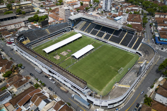 Workers set up tents at the Vila Belmiro stadium, the home of the Santos FC soccer club where soccer legend Pele played most of his career, in Santos, Brazil, Sunday, Dec. 25, 2022. (AP Photo/Matias Delacroix)