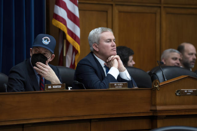 House Oversight and Accountability Committee Chairman James Comer, R-Ky., center, joined by Rep. Jamie Raskin, D-Md., left, the ranking member, leads a hearing on fraud and waste in the COVID-19 relief programs, at the Capitol in Washington, Wednesday, Feb. 1, 2023. (AP Photo/J. Scott Applewhite)