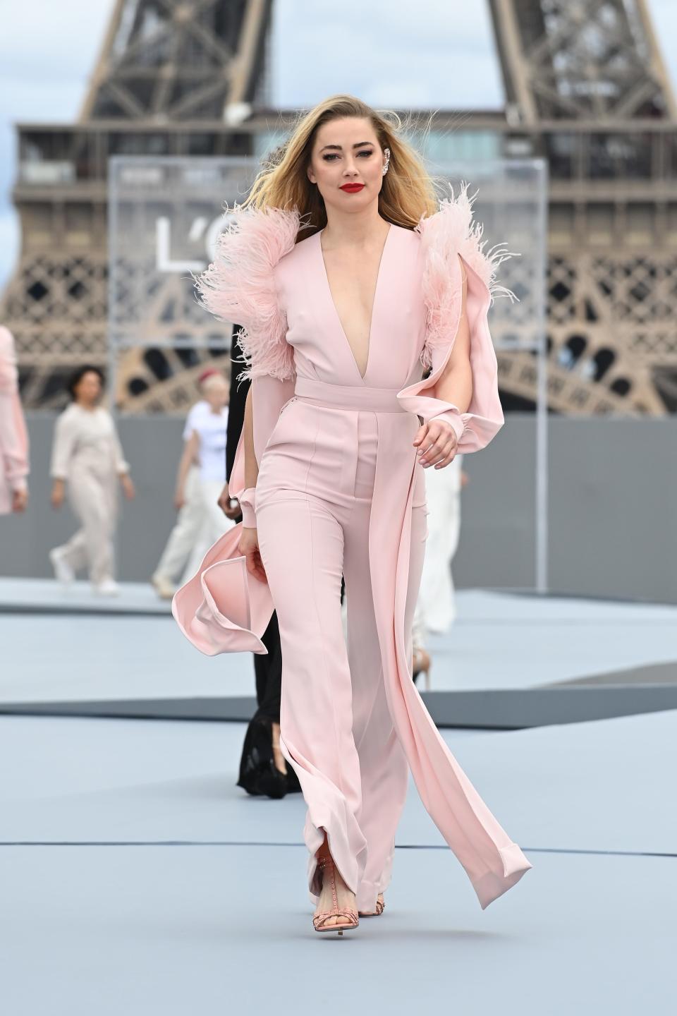 Amber Heard walks the runway during Paris Fashion Week on Oct. 3, 2021 in Paris.