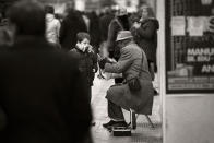 January 7: Where Music Is Hidden by Oriol Colls. 'I was taking pictures of a street musician. He had a boy close to him, looking at the way that he was playing. Suddenly, the musician stopped playing and offered him the instrument, so he could see how the sound was made. It was a magical scene taken in Gran Via, Madrid, Spain, with a Nikon D800+70-200 VRII.'