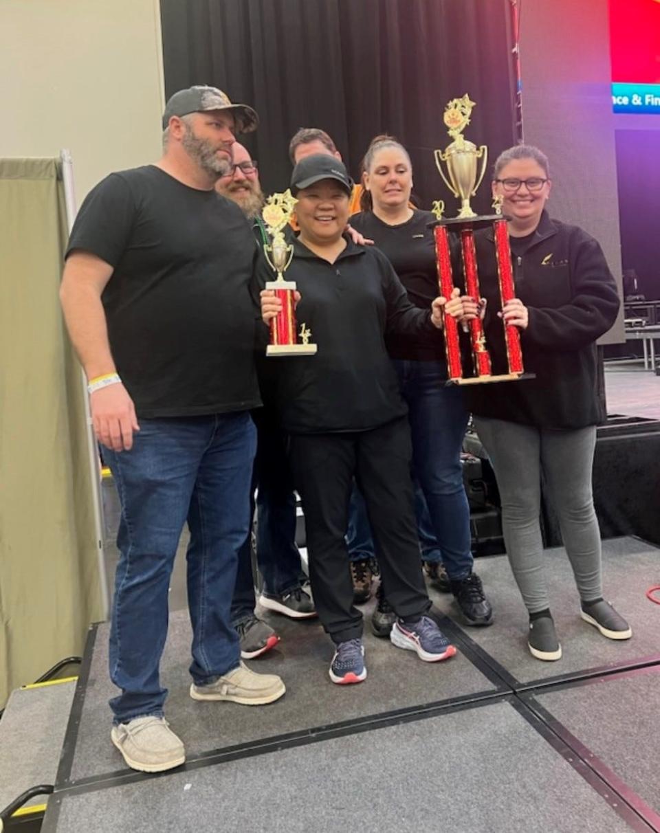 From left to right, Chad Viele, Christina "Sam" Baird and Melinda Heard pose for a photo with their People's Choice trophy during the Sertoma Chili Cook-Off on Saturday, Feb. 18, 2023.