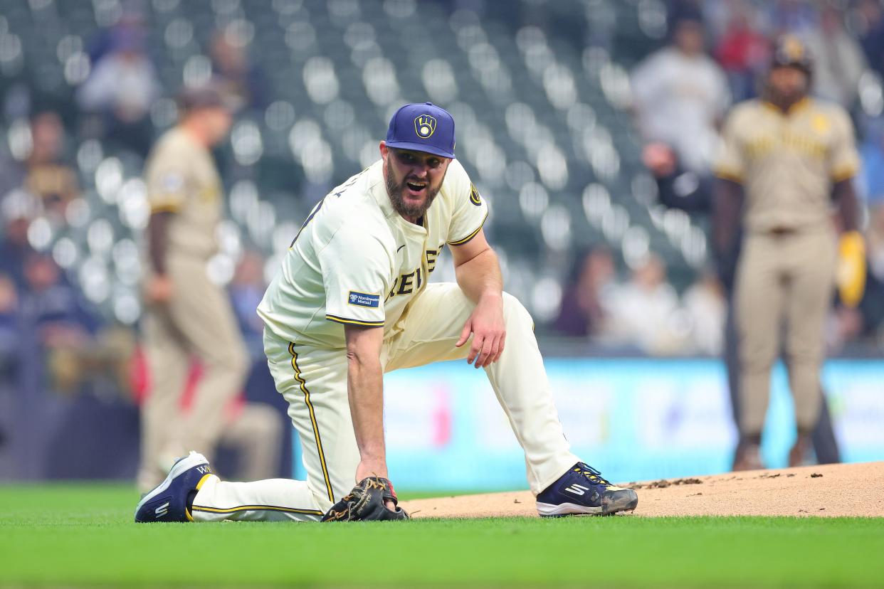 Brewers starting pitcher Wade Miley kneels after being hit on the left knee by a ball off the bat of the Padres' Manny Machado last week at American Family Field.