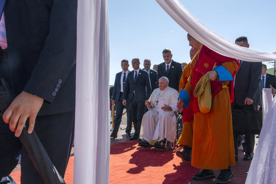 Pope Francis, center, arrives at a meeting with religious leaders at the Hun Theatre in the Sky Resort compound some 15 kilometers south of the Mongolian capital Ulaanbaatar, Sunday, Sept. 3, 2023. Pope Francis has praised Mongolia’s tradition of religious freedom dating to the times of founder Genghis Khan during the first-ever papal visit to the Asian nation.(AP Photo/Louise Delmotte)