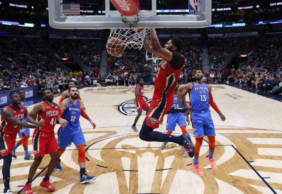 New Orleans Pelicans forward Anthony Davis dunks in the first half of an NBA basketball game against the Oklahoma City Thunder in New Orleans, Wednesday, Dec. 12, 2018. (AP Photo/Gerald Herbert)