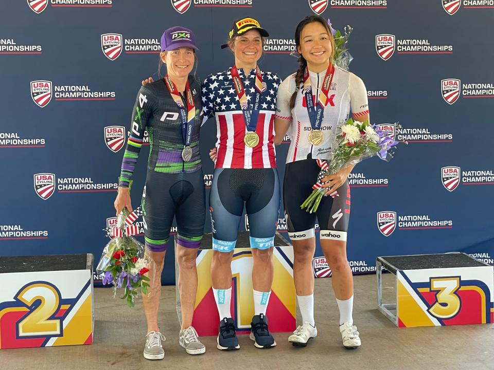 Women's Elite Time Trial Champion Leah Thomas (center) with silver medalist Amber Neven (left) and bronze medalist Zoe Ta-Perez at the podium.