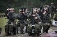 PARRIS ISLAND, SC - FEBRUARY 25: Female Marine recruits prepare to fire on the rifle range during boot camp February 25, 2013 at MCRD Parris Island, South Carolina. All female enlisted Marines and male Marines who were living east of the Mississippi River when they were recruited attend boot camp at Parris Island. About six percent of enlisted Marines are female. (Photo by Scott Olson/Getty Images)