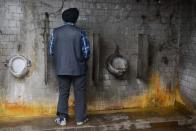<p>A man uses a public toilet in Amritsar, India. (Photo: Narinder Nanu/AFP/Getty Images) </p>