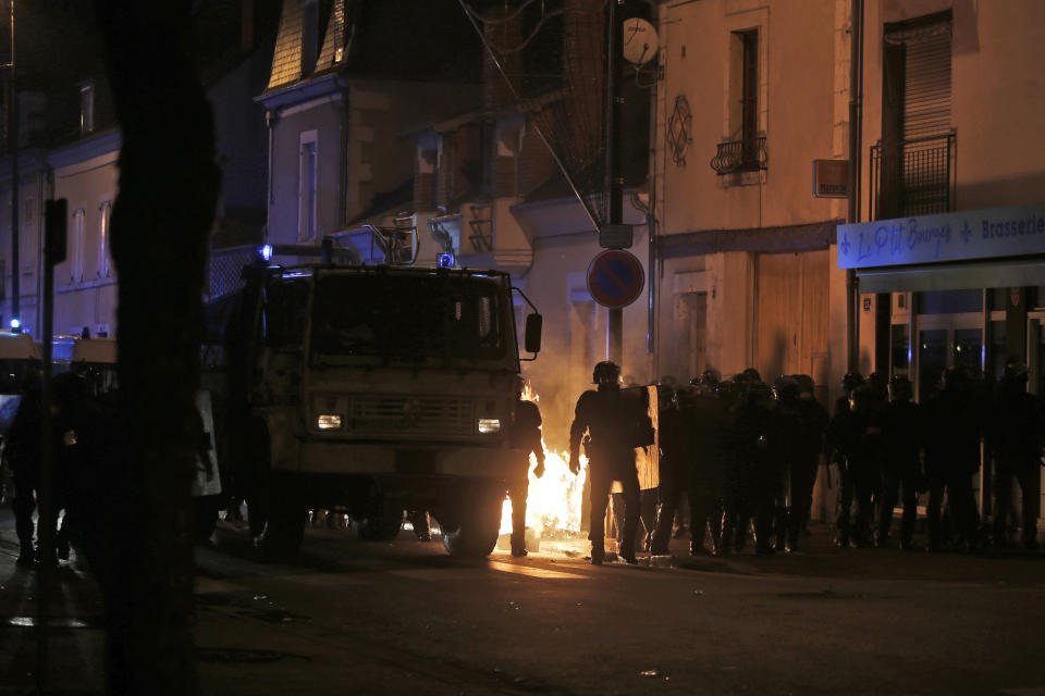 French riot police clears the streets of yellow vest protestors in Bourges, central France, Saturday, Jan. 12, 2019. The French Interior Ministry says about 32,000 people have turned out in yellow vest demonstrations across France, including 8,000 in Paris, where scuffles broke out between protesters and police. (AP Photo/Rafael Yaghobzadeh)