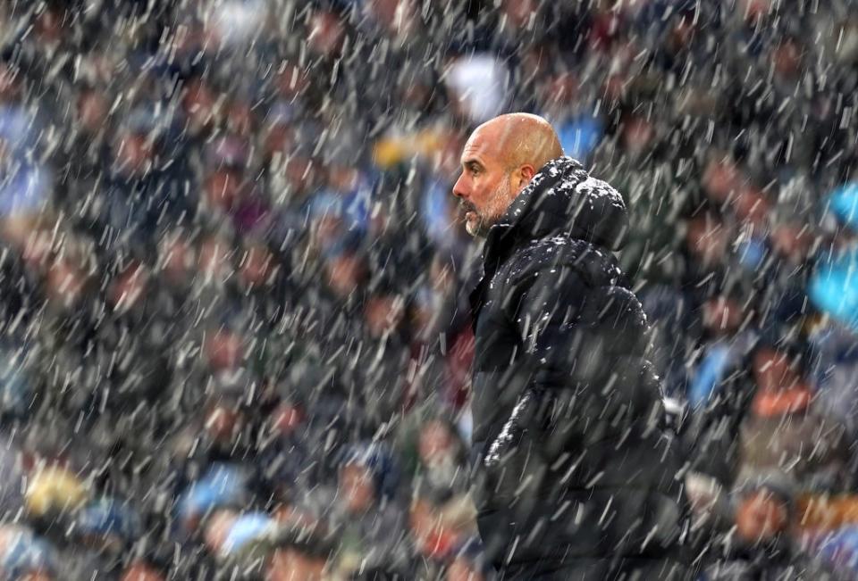 Manchester City manager Pep Guardiola saw his side brave the elements to beat West Ham 2-1 at a snowy Etihad Stadium, which cut Chelsea’s lead down to a point (Martin Rickett/PA) (PA Wire)