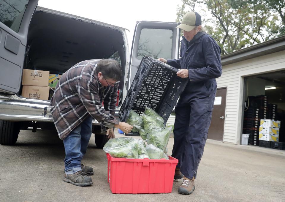 Riverview Gardens' Rachel Van Daalwyk helps load a food delivery with Apostolic Truth Church's Ed Barribeau on Tuesday, October 10, 2023, at Riverview Gardens in Appleton, Wis. Feeding America's Farm Link program purchases produce from local farmers, including Appleton's Riverview Gardens, that farmers then deliver directly to local food pantries within mere miles of the farm. In four years, distribution has grown from 90,285 pounds to 229,747 pounds and helps increase pantry clients' access to healthy, fresh, nutritious produce.
Wm. Glasheen USA TODAY NETWORK-Wisconsin
