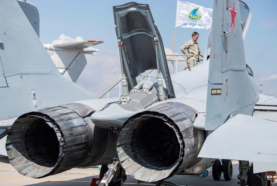 <p>A Russian pilot stands next to his Mig 29 military plane on display at the annual air show MAKS 2017 in Zhukovsky on July 18, 2017, some 40 km outside Moscow, Russia. (Photo: Mladen Antonov/AFP/Getty Images) </p>