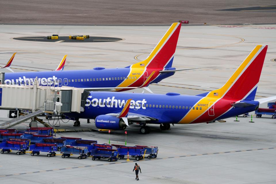 Southwest Airlines jets are parked at gates at Phoenix Sky Harbor International Airport on Dec. 29, 2022.